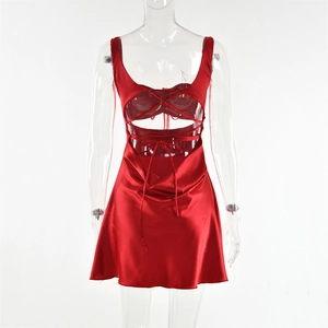 Detail of red satin backless dress featuring intricate hollow out lace-up strap design