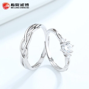 Detail of adjustable sterling silver couple rings with six-prong zircon setting