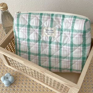 Quilted plaid makeup bag in green and pink with zipper closure and large capacity