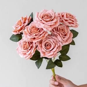 Dusty pink artificial rose bouquet with seven blooms and green leaves for home decoration