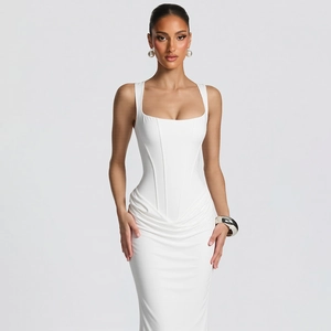 Close-up of white ruched bodycon dress with corset-style top and elegant draped skirt