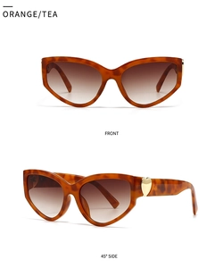 Detailed front and side view of orange tea cat eye sunglasses with golden heart detail