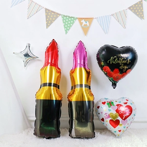Valentine's Day balloon set with lipstick shapes and heart designs on white rug
