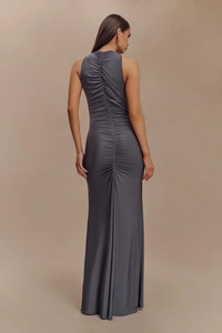 Detail view of the sleek back ruching and gathering on a dark gray maxi bodycon dress