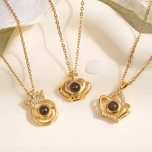 Gold crown pendant necklace with 100 languages I love you projection stone detail