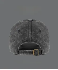 Detail view of washed dark grey baseball cap with adjustable metal buckle and cotton texture