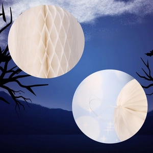 Detail showing 3D honeycomb structure and hanging string of white paper ghost decor