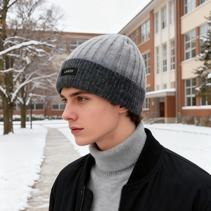 Winter thermal knit beanie in grey two-tone pattern with a thick ribbed fold and woven label