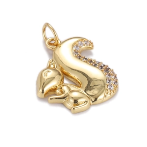 Detailed view of a gold-plated squirrel pendant with shimmering crystal-studded tail