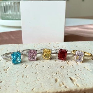 Close-up of five S925 silver rings with colorful rectangular radiant-cut ice flower zircons