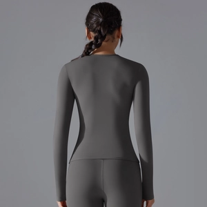 Back view of tight-fit dark grey yoga long sleeve and high waist sports leggings