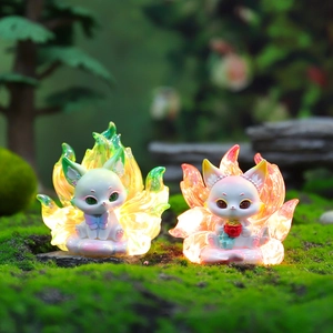 Luminous glow fox figurines on mossy landscape with magical forest lighting