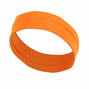 Close-up of bright orange elastic sport headband with soft breathable fabric texture