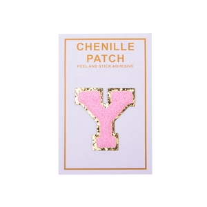 Close-up of pink chenille letter Y patch with gold glitter edge and peel and stick adhesive