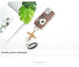 Detailed view of brown phone case with puppy design, braided lanyard and leather key pouch