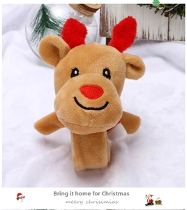 Detail of plush reindeer slap bracelet with soft brown fabric and festive red antlers
