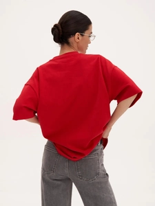 Back view of a loose-fit oversized 100% cotton T-shirt in vibrant red color