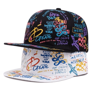 Detail of colorful graffiti print on hip-hop snapback caps in black and white