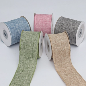 Close-up of faux linen ribbons in five pastel colors showing detailed woven texture for DIY