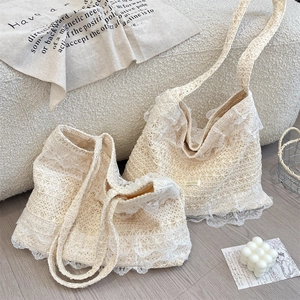 Detail of floral lace crochet patterns and delicate ruffles on cream tote bags
