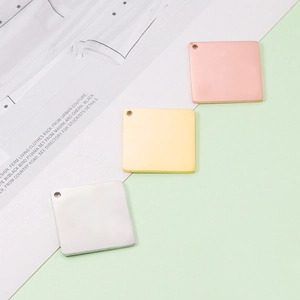 Polished 25mm square stainless steel calendar tags in silver, gold, and rose gold finishes