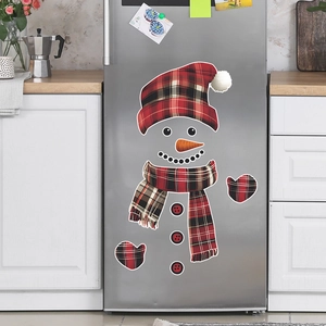 Cartoon snowman fridge magnet set with red plaid accessories on a stainless steel door