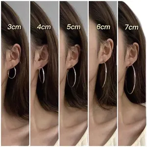 Silver hoop earrings in 3cm to 7cm sizes showcased on models for size comparison