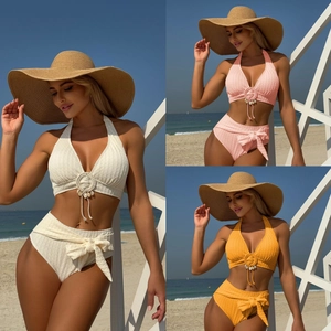 Detail of high waist bikini sets with seashell accents and textured bubble fabric