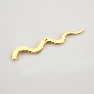 Detail of S925 sterling silver stamp on minimalist curved gold pendant necklace