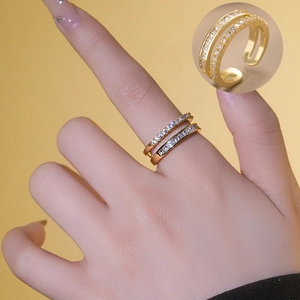 Minimalist double-layered gold open ring with square and round zircon stones on a model
