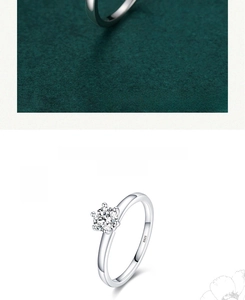 Detail of classic six-prong S925 sterling silver ring with sparkling round cubic zirconia