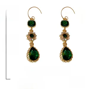 Detailed macro view showing the green waterdrop zircon and floral crystal earrings