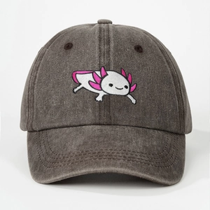 Close-up detail of the washed dark grey cotton fabric and axolotl embroidery on the cap