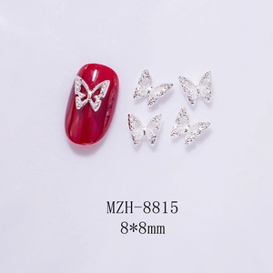 Macro view of 8x8mm silver metal hollow butterfly nail art charms with glitter finish