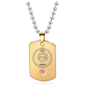 Detailed engraving of Cancer zodiac sign on a gold pendant necklace with pink gemstone