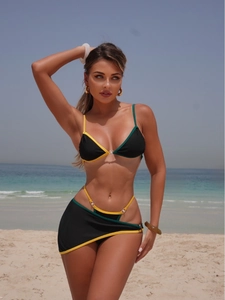 Three-piece bikini set with neon trim and matching cover-up on a sunny beach