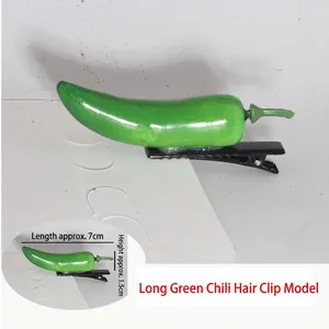 Detail view of 7cm green chili hair clip with realistic resin texture and metal clip