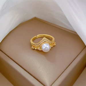 Elegant gold crown ring with a round pearl and zircons, adjustable open band style