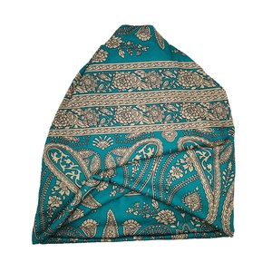 Detail of turquoise paisley pattern cotton headscarf with bohemian knot design