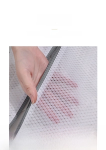 Close-up of durable honeycomb mesh laundry bag featuring fine white fabric and grey zipper
