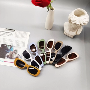 Children's vintage rectangular sunglasses in eight vibrant colors on minimalist background