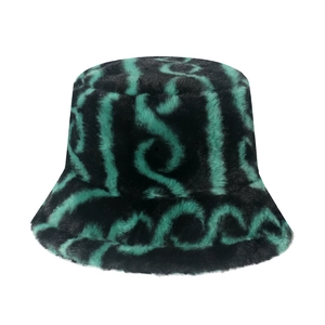 Plush faux fur bucket hat featuring a black and green abstract wave pattern design
