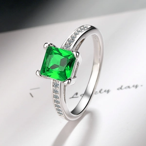 Macro view of S925 silver ring featuring a four-prong square green zircon stone