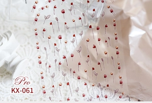 Detailed close-up of KX-061 floral nail stickers with red tulip designs on white lace
