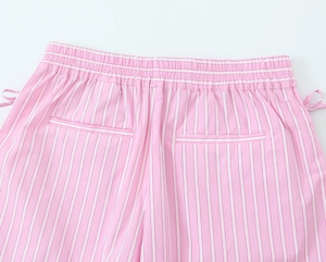 Detail of pink and white striped poplin shorts with elastic waistband and back pockets