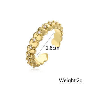 Macro detail of 18K gold plated heart ring with zircons showing 1.8cm inner diameter