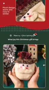 Detail of plush Christmas drawstring gift bag with 3D Santa Claus face and soft fur texture