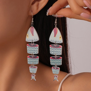 Exaggerated fishbone tassel earrings with colorful wood print on a female model