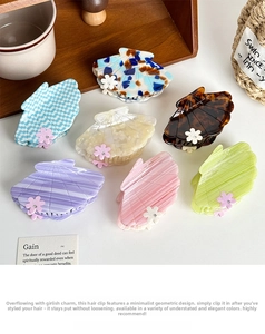 Detailed set of seven seashell acetate hair claws with floral crystal accents