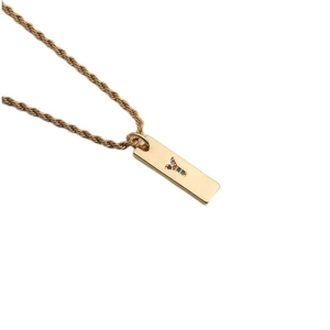 Detail view of a gold rectangular pendant with colorful zircon letter Y on a twist chain